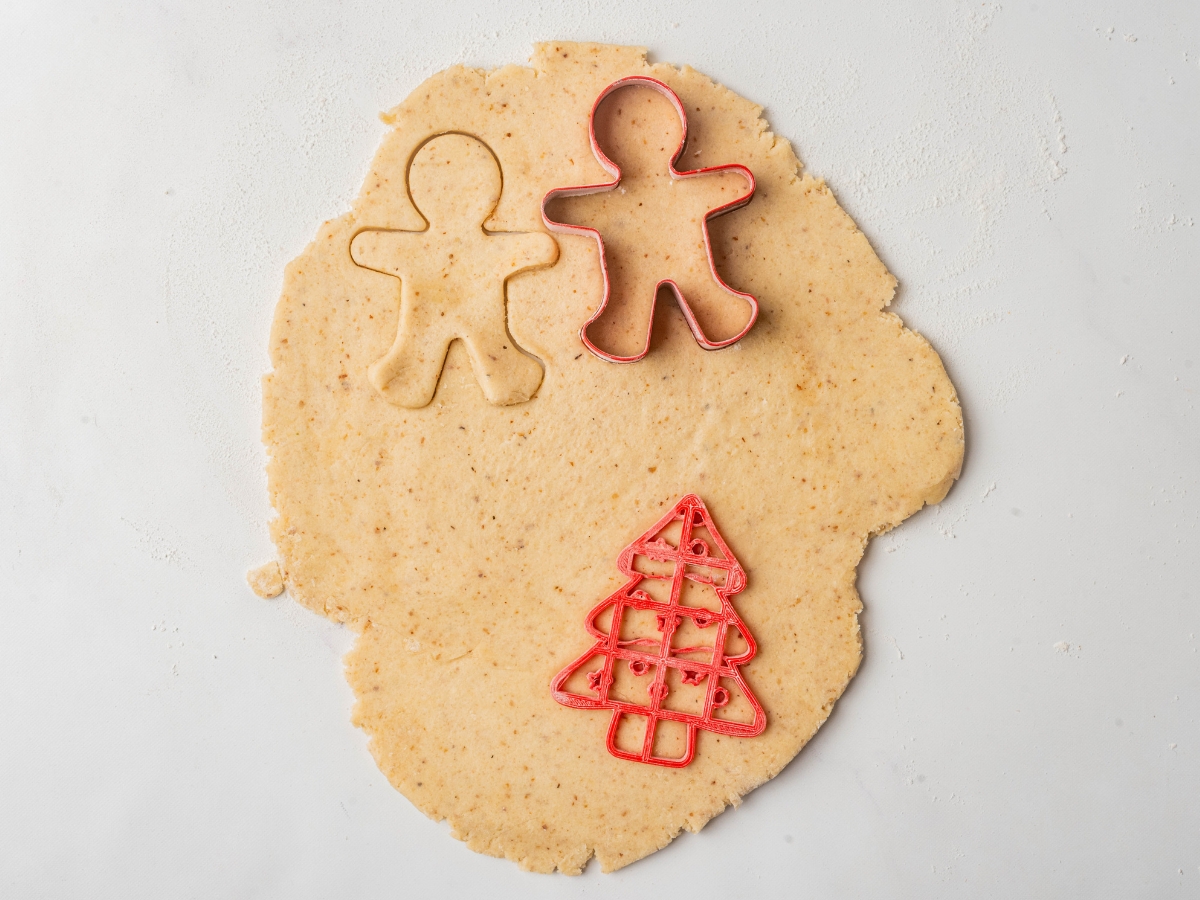 using christmas cookie cutters to make keto christmas cookies 