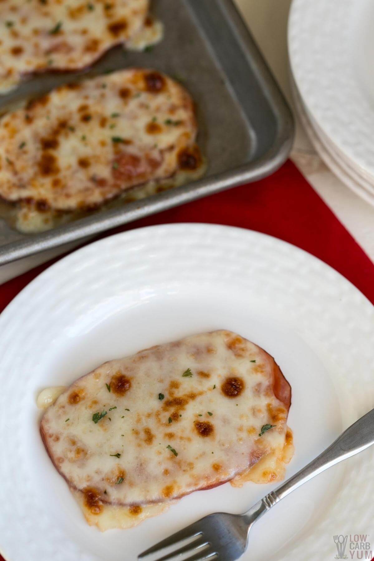 pizza on white plate and sheet pan