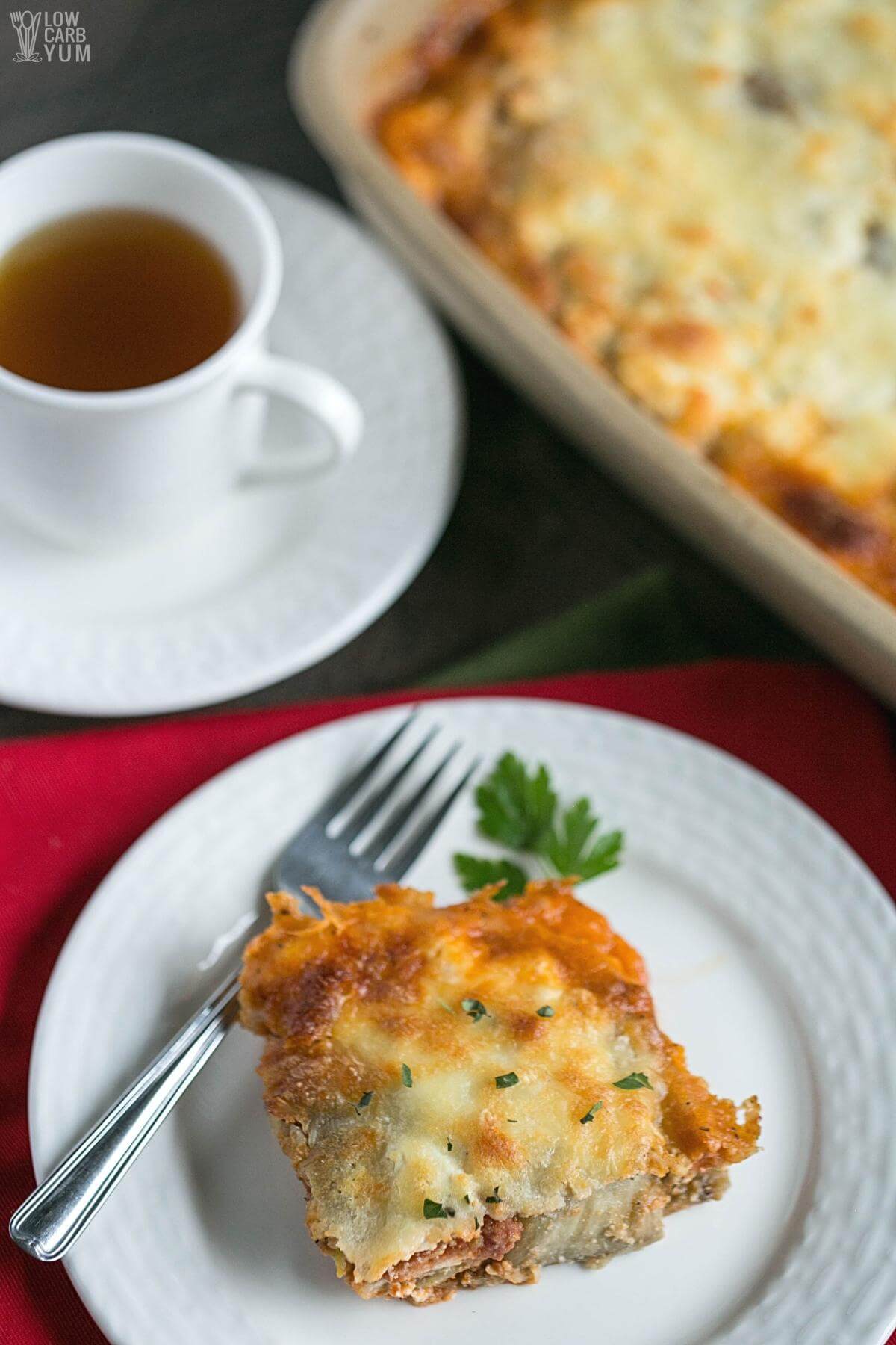 serving the eggplant casserole with a cup of hot tea