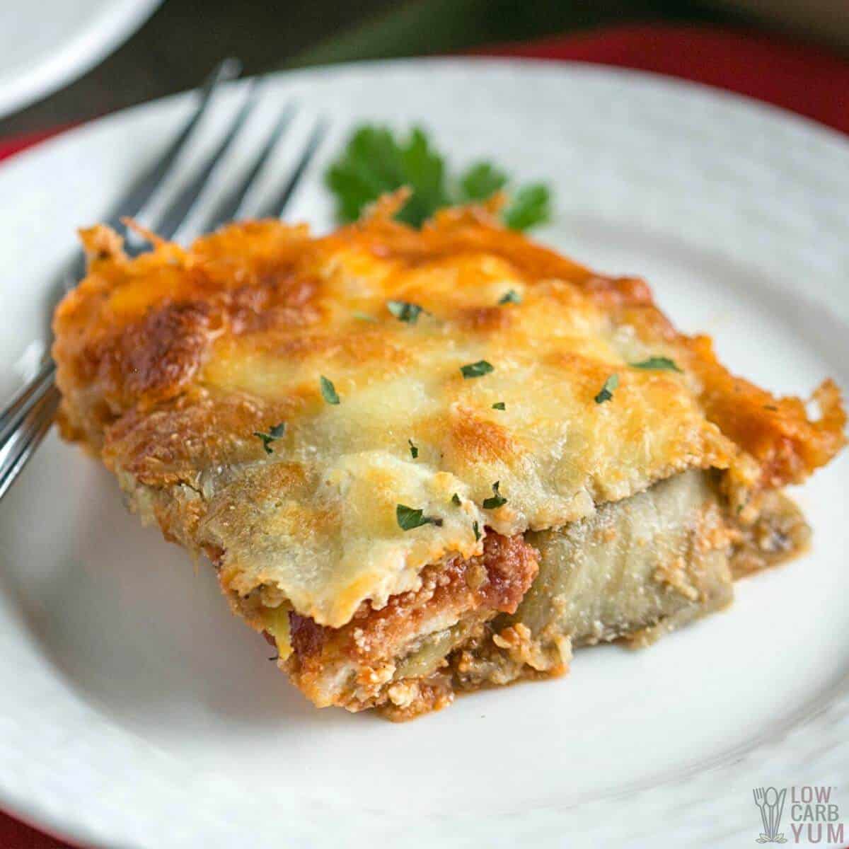 eggplant parmesan casserole slice on white plate