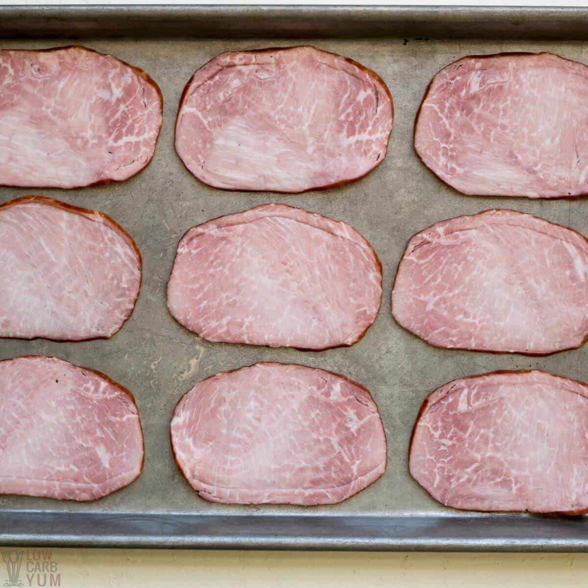 ham slices on baking sheet