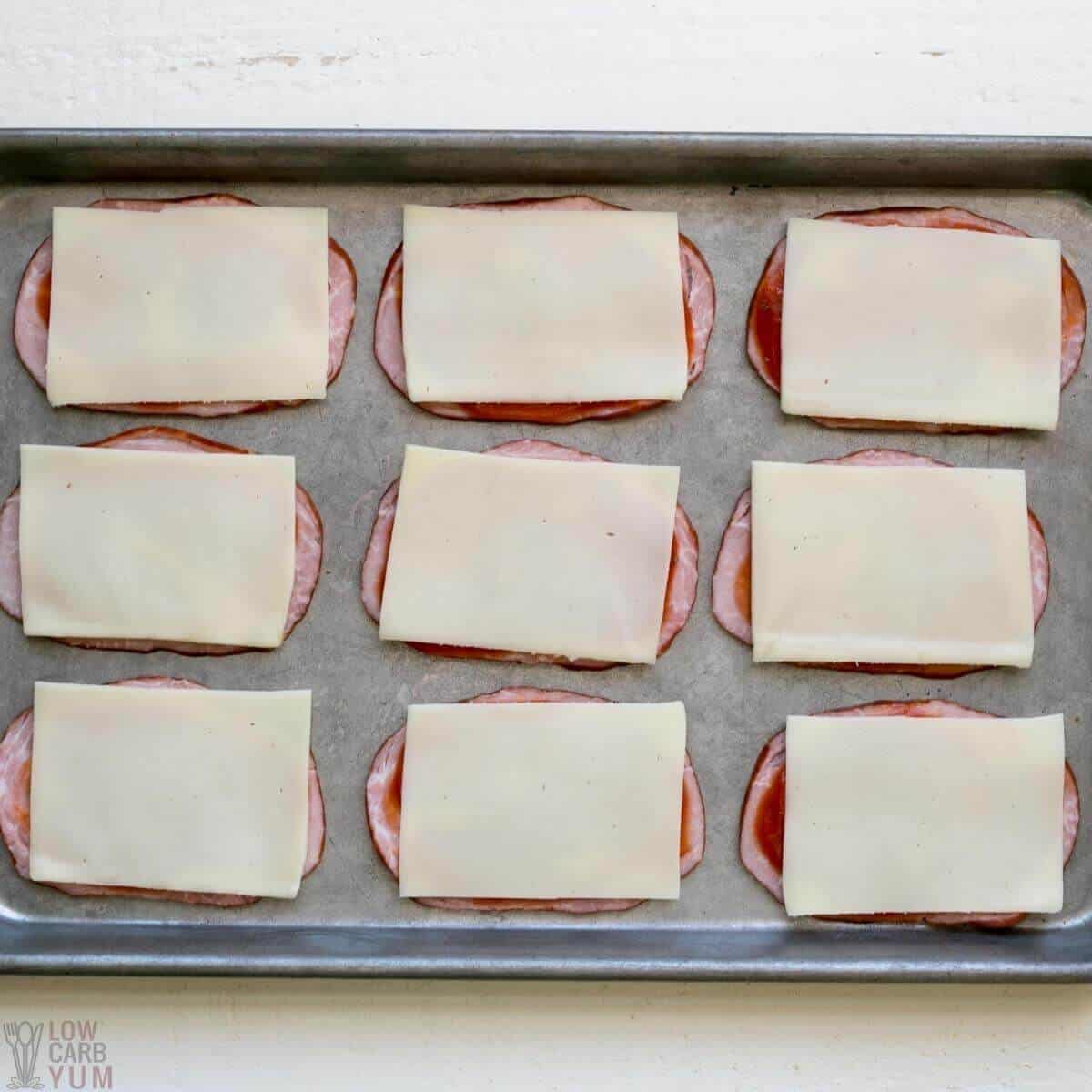 adding mozzarella slices