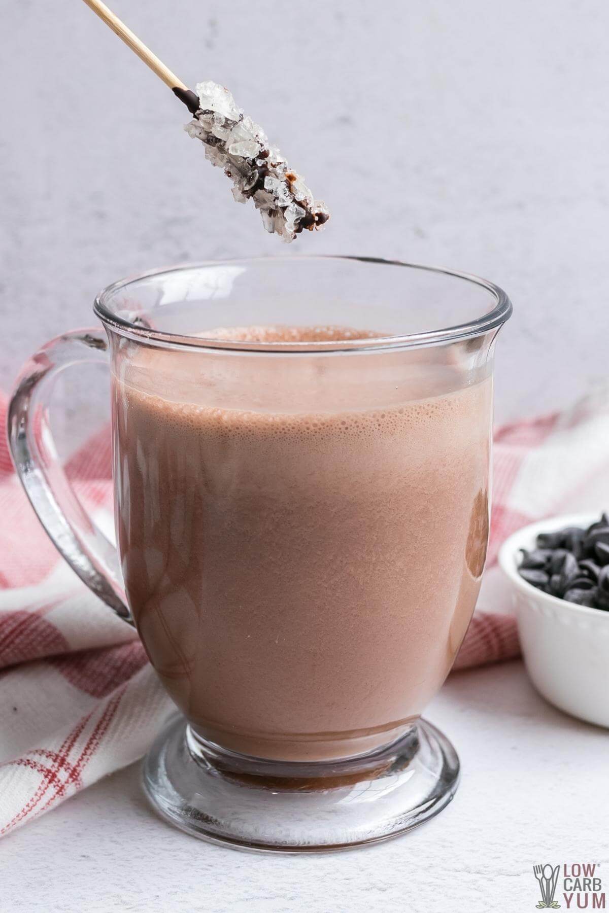 dipping stirrer into hot chocolate