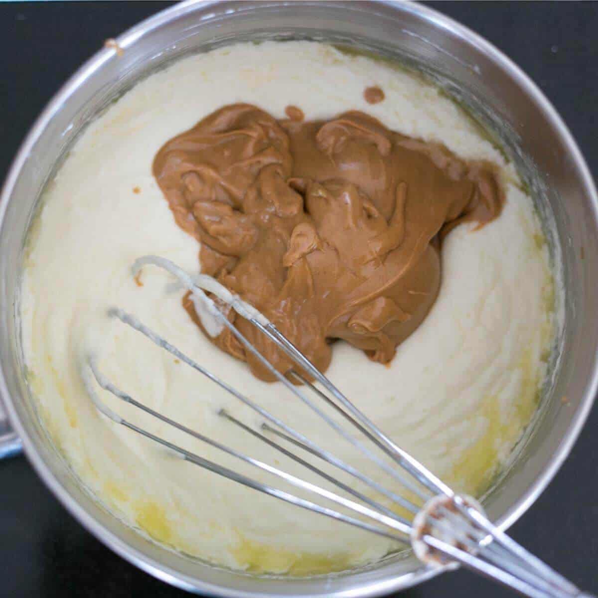adding the peanut butter to fudge mix