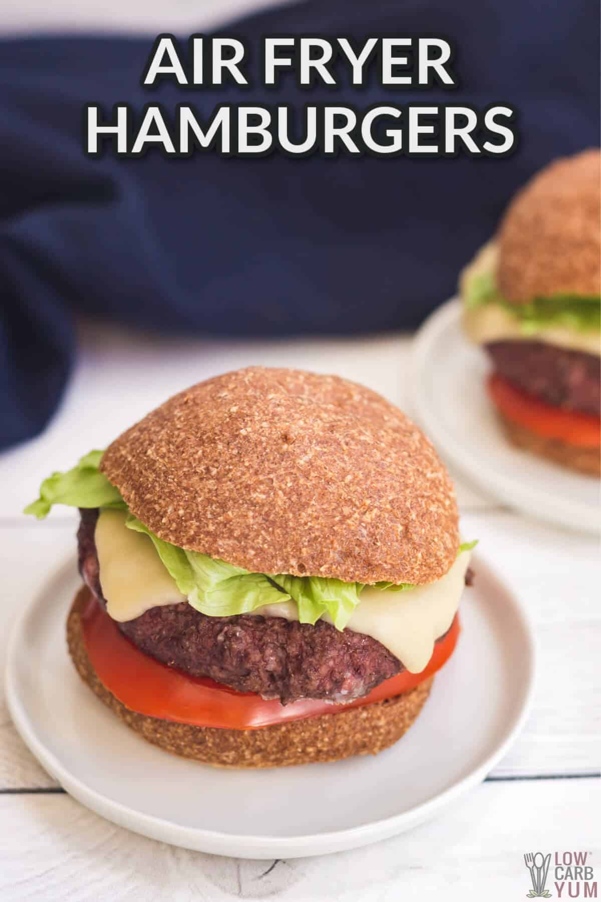 air fryer hamburgers on white plates with blue towel