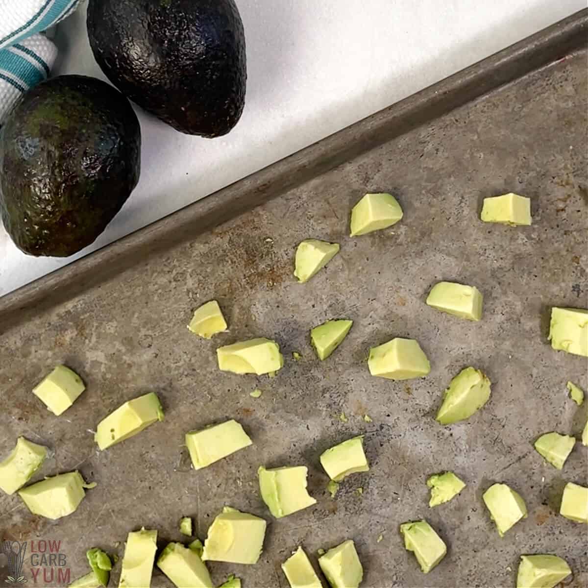 freezing avocado cubes on baking sheet