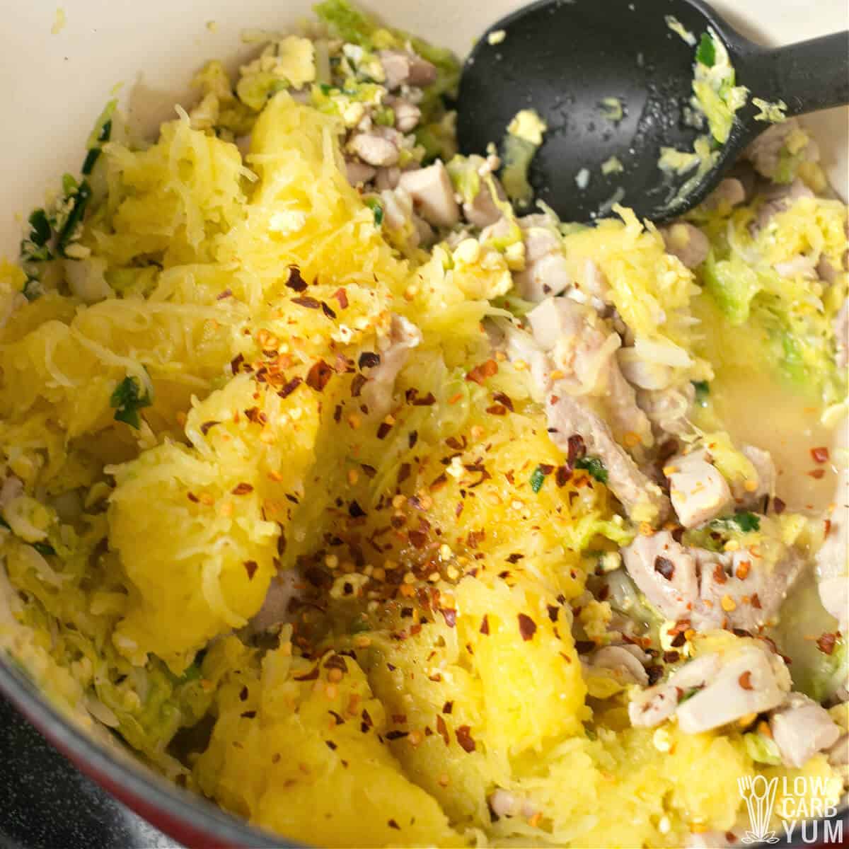 spaghetti squash and seasonings added to pot