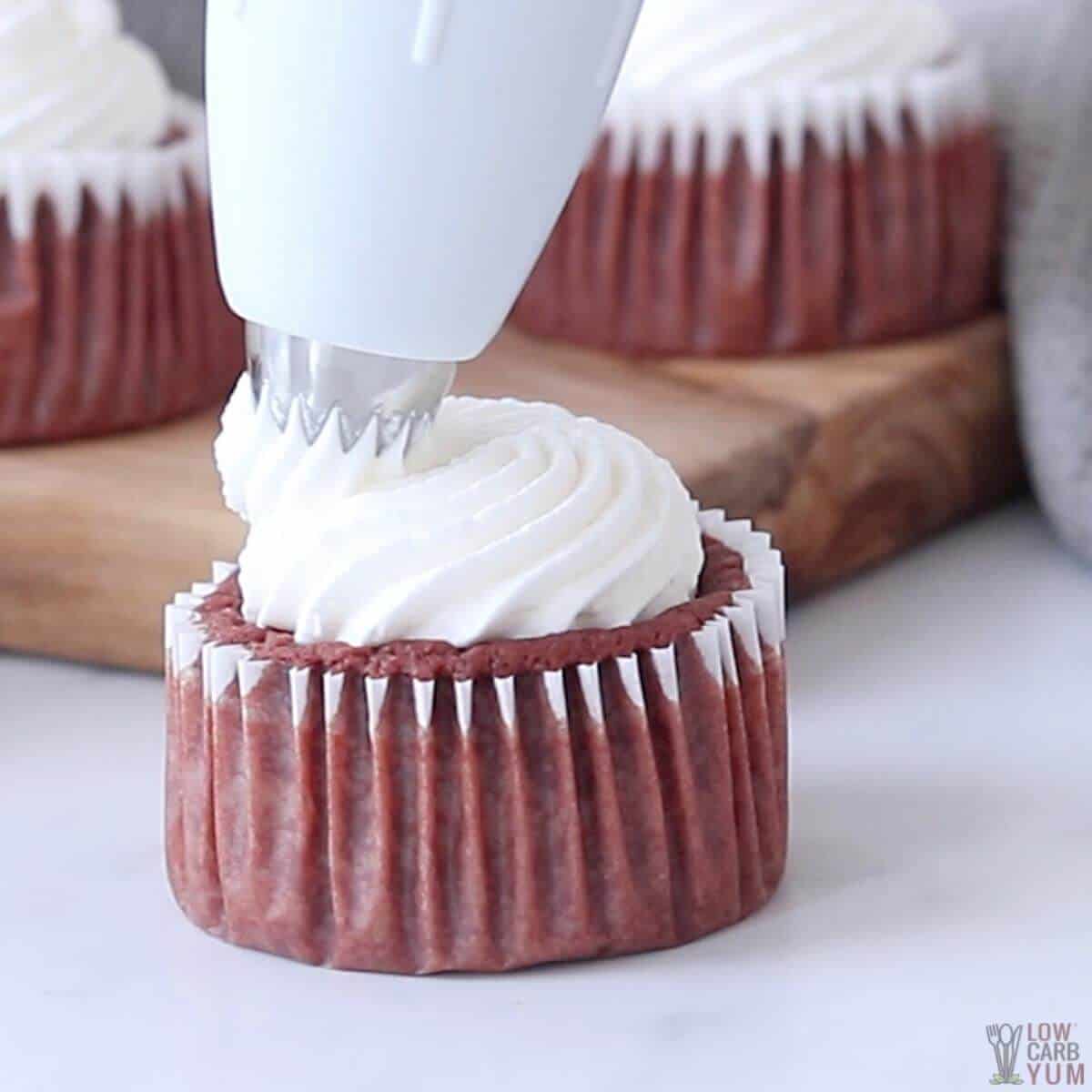 frosting one of the cupcakes