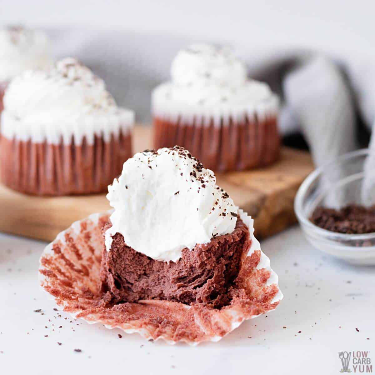red velvet cheesecake cupcake bitten in half