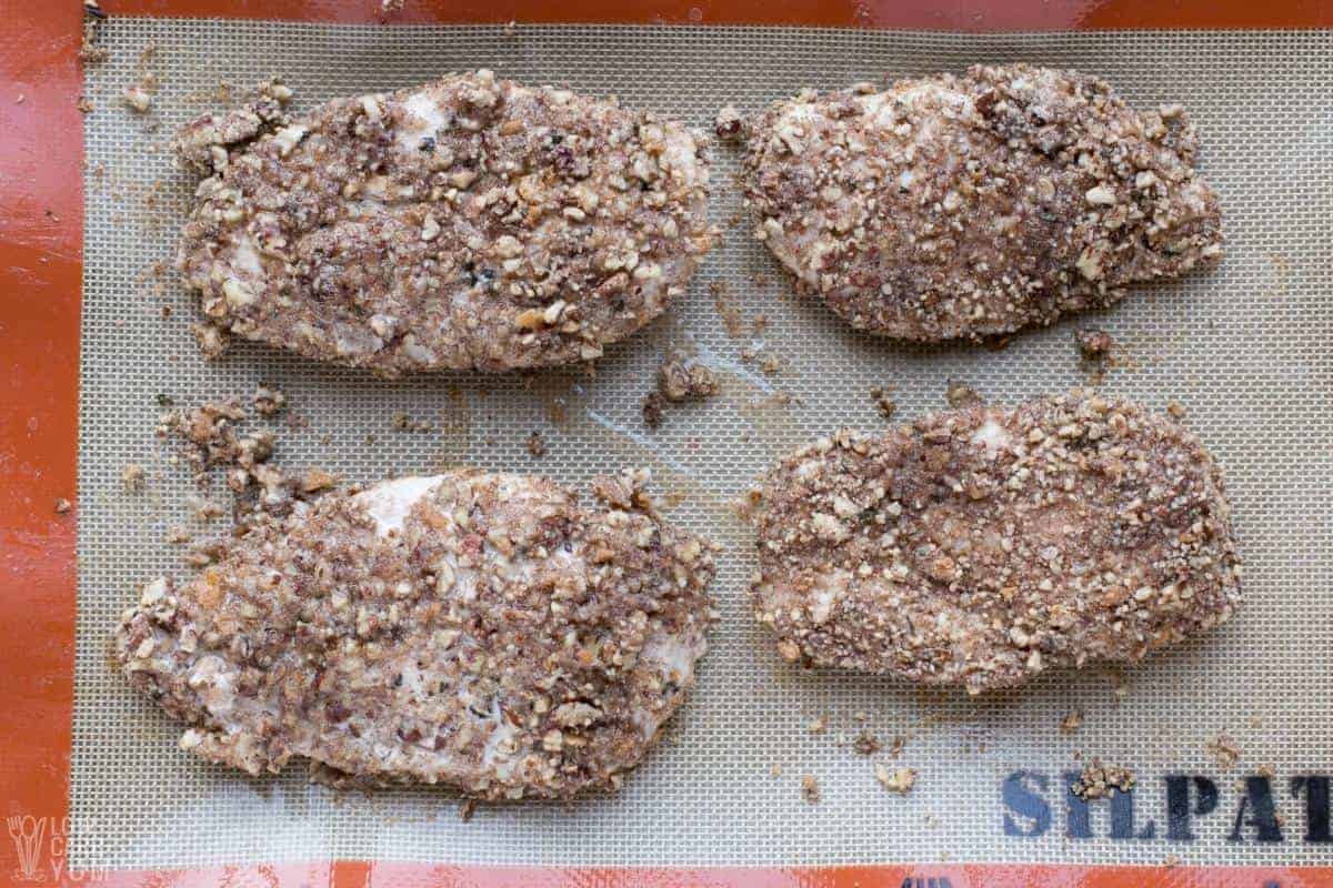 baked chicken with pecan coating.