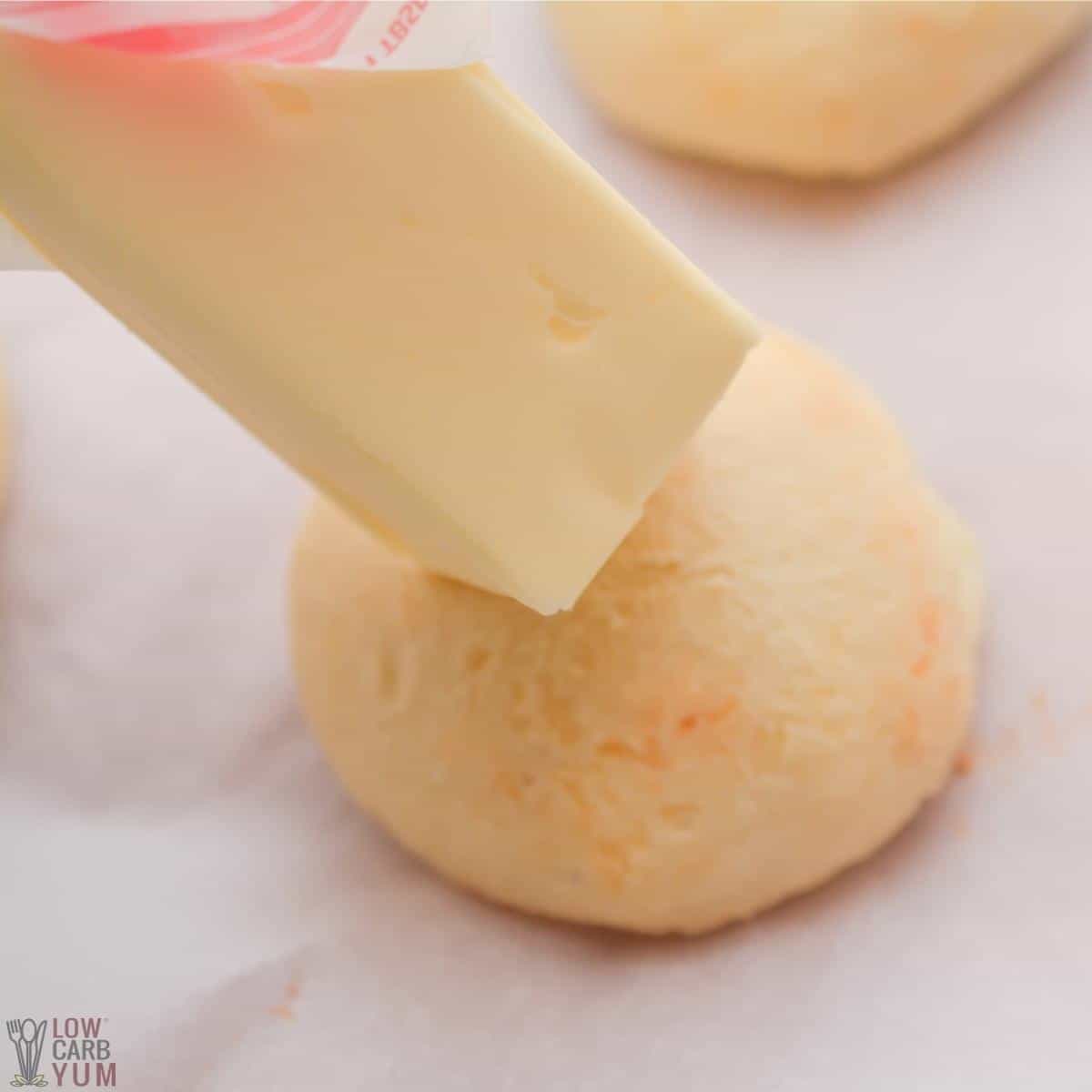 topping roll with butter.