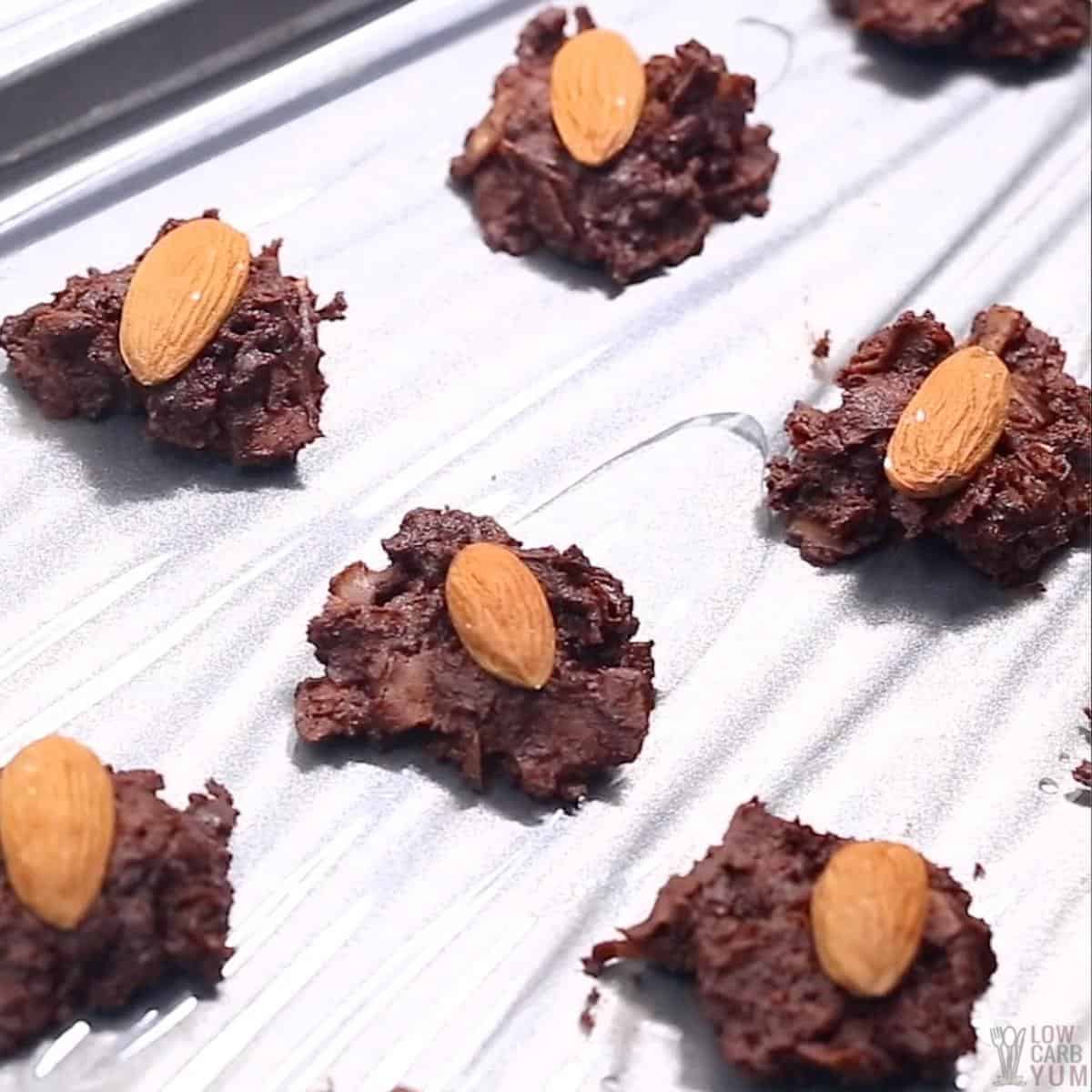 coconut chocolate candy on lined sheet pan.