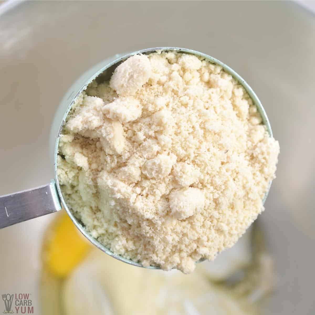 adding almond flour to mixing bowl.