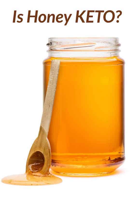 honey in jar and dripping from spoon