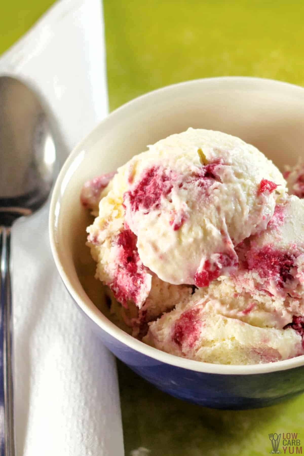 keto raspberry cheesecake ice cream in small bowl closeup.