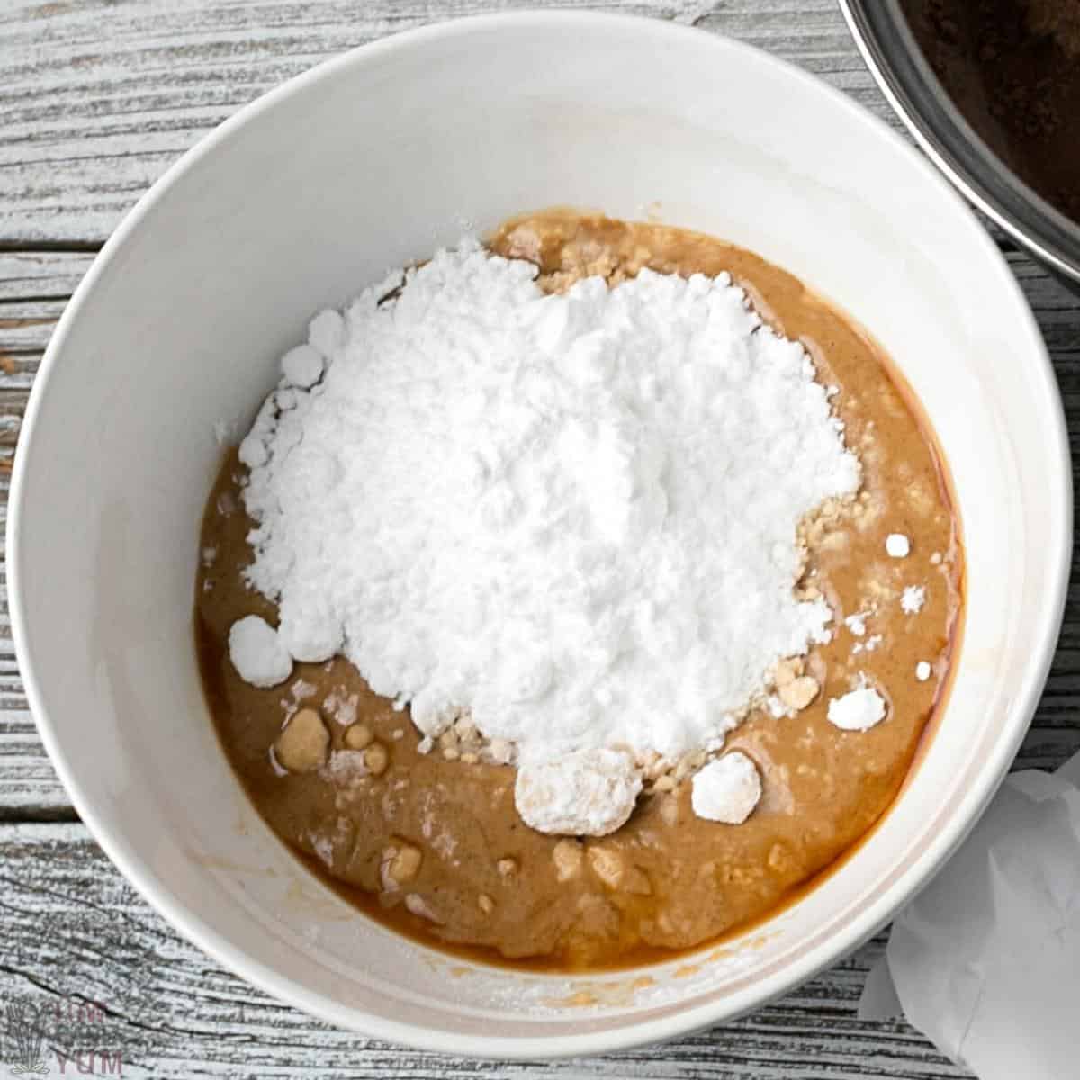 peanut butter mixture ingredients in white mixing bowl.