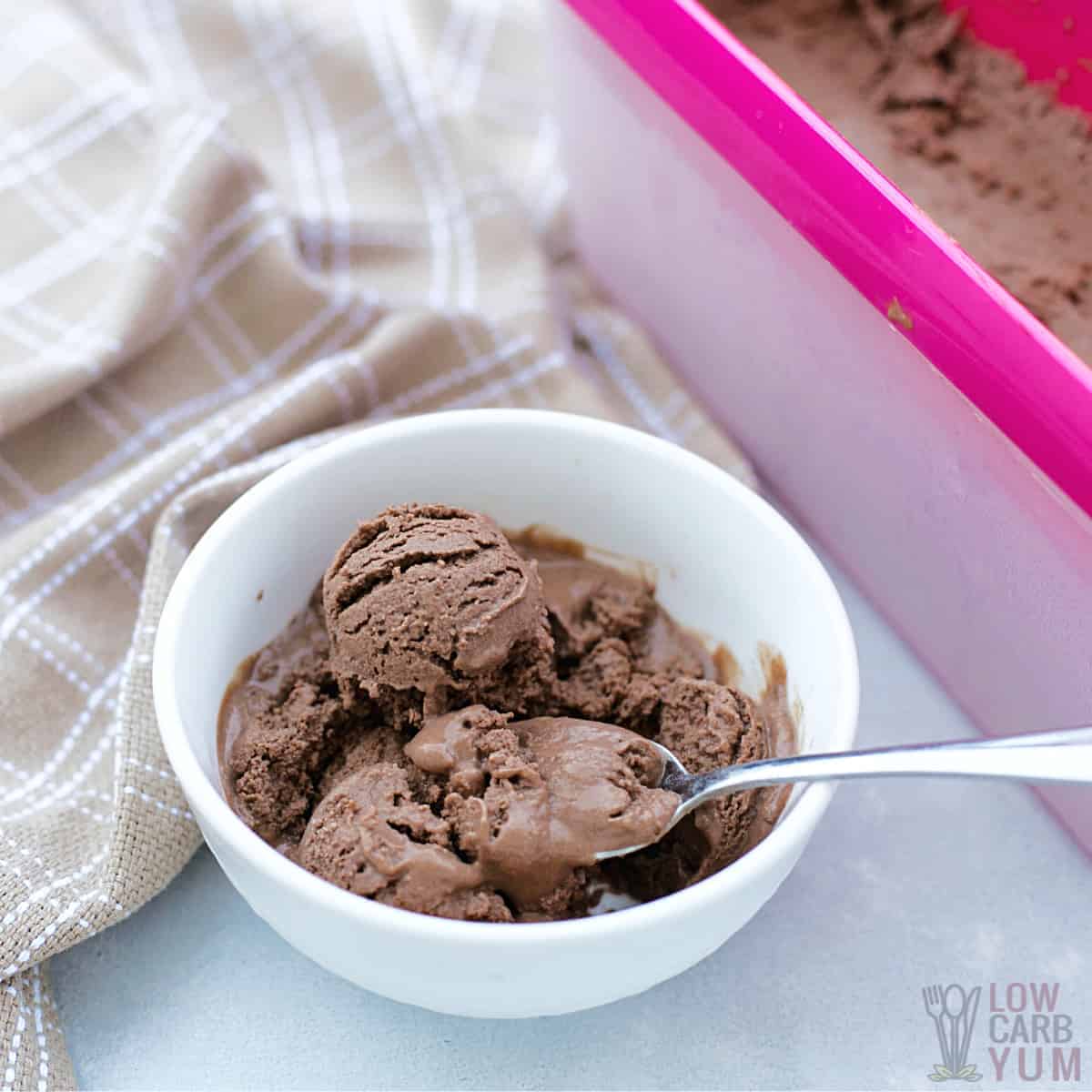 serving avocado ice cream in small white bowl with spoon.