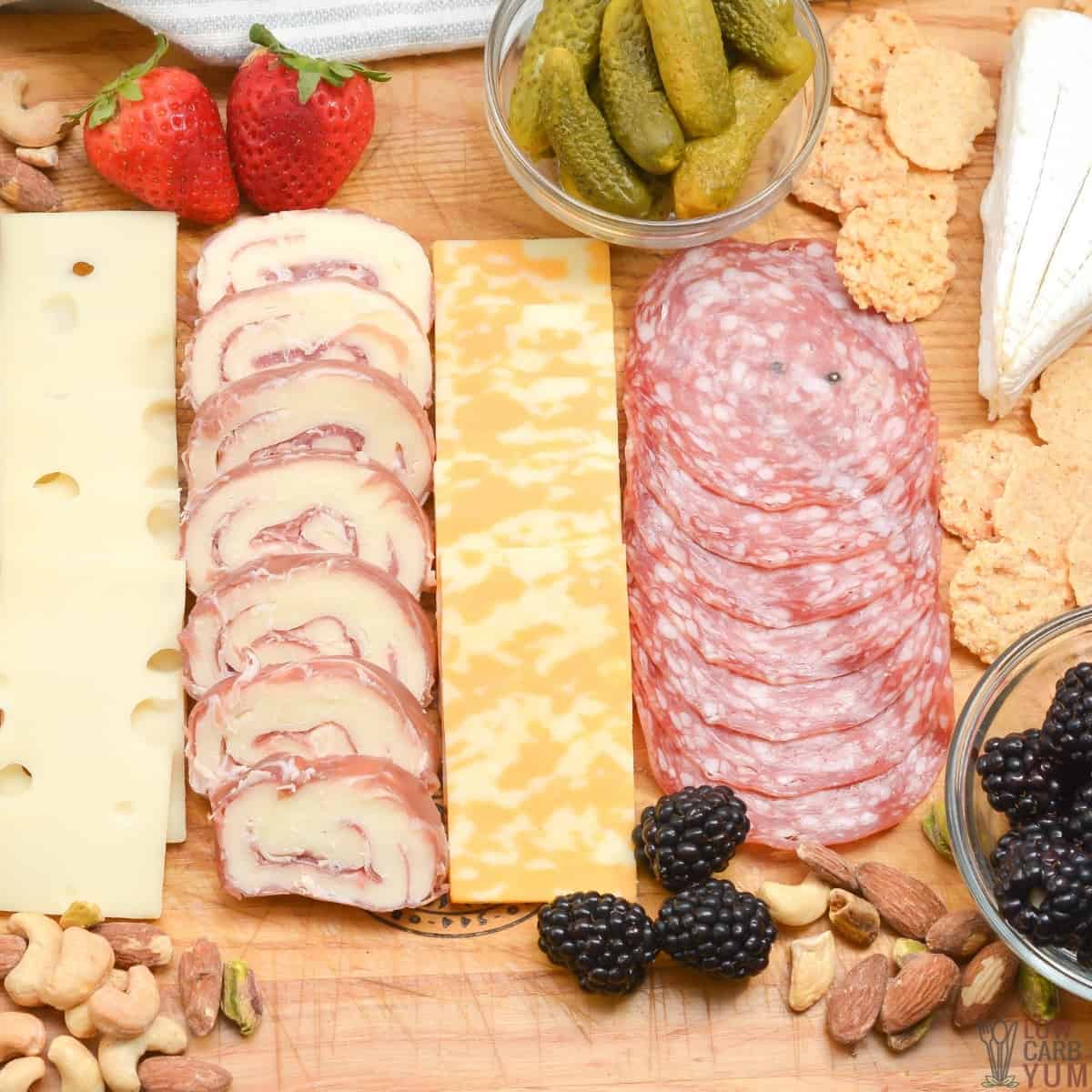 keto charcurterie board with meat cheese nuts fruit.
