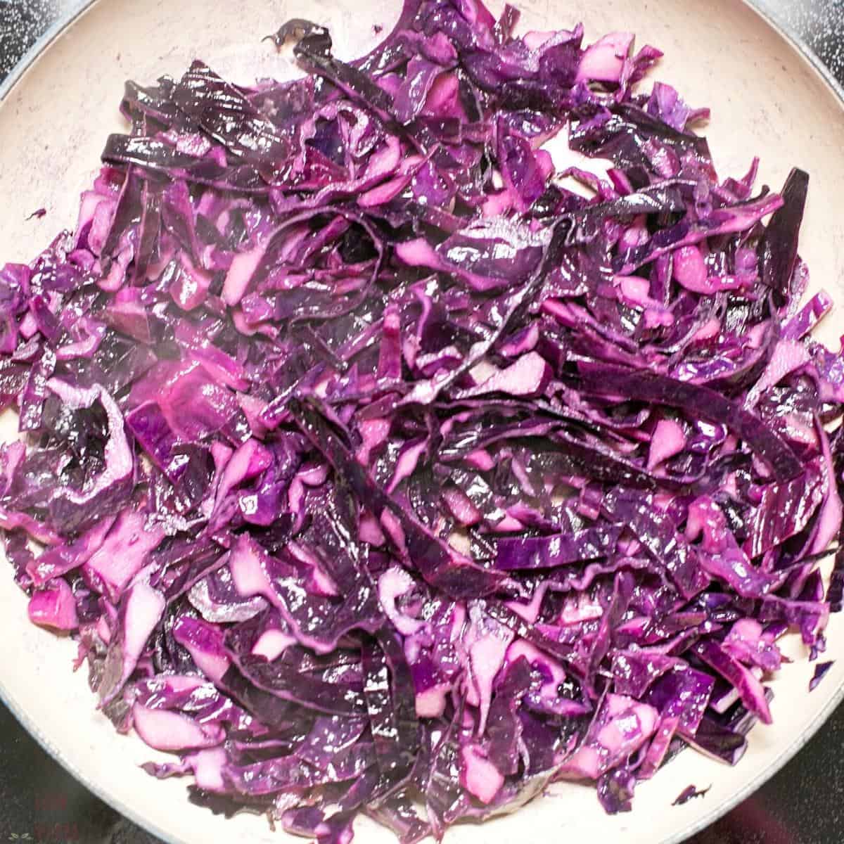 sautéed red cabbage in skillet.