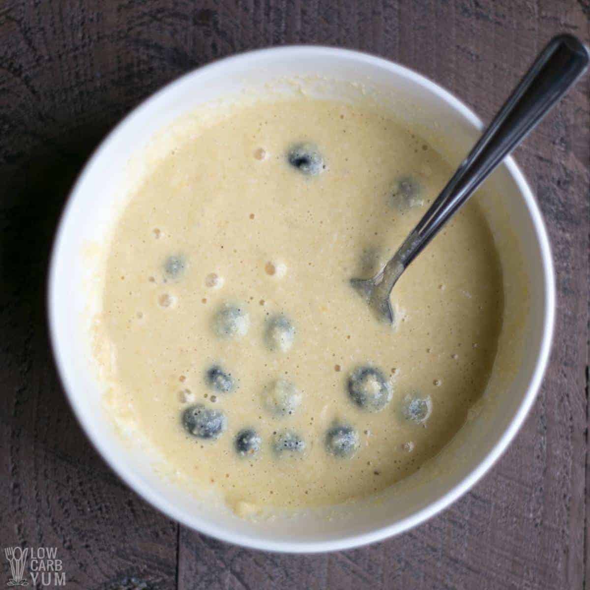 blueberry mug cake batter in white bowl.