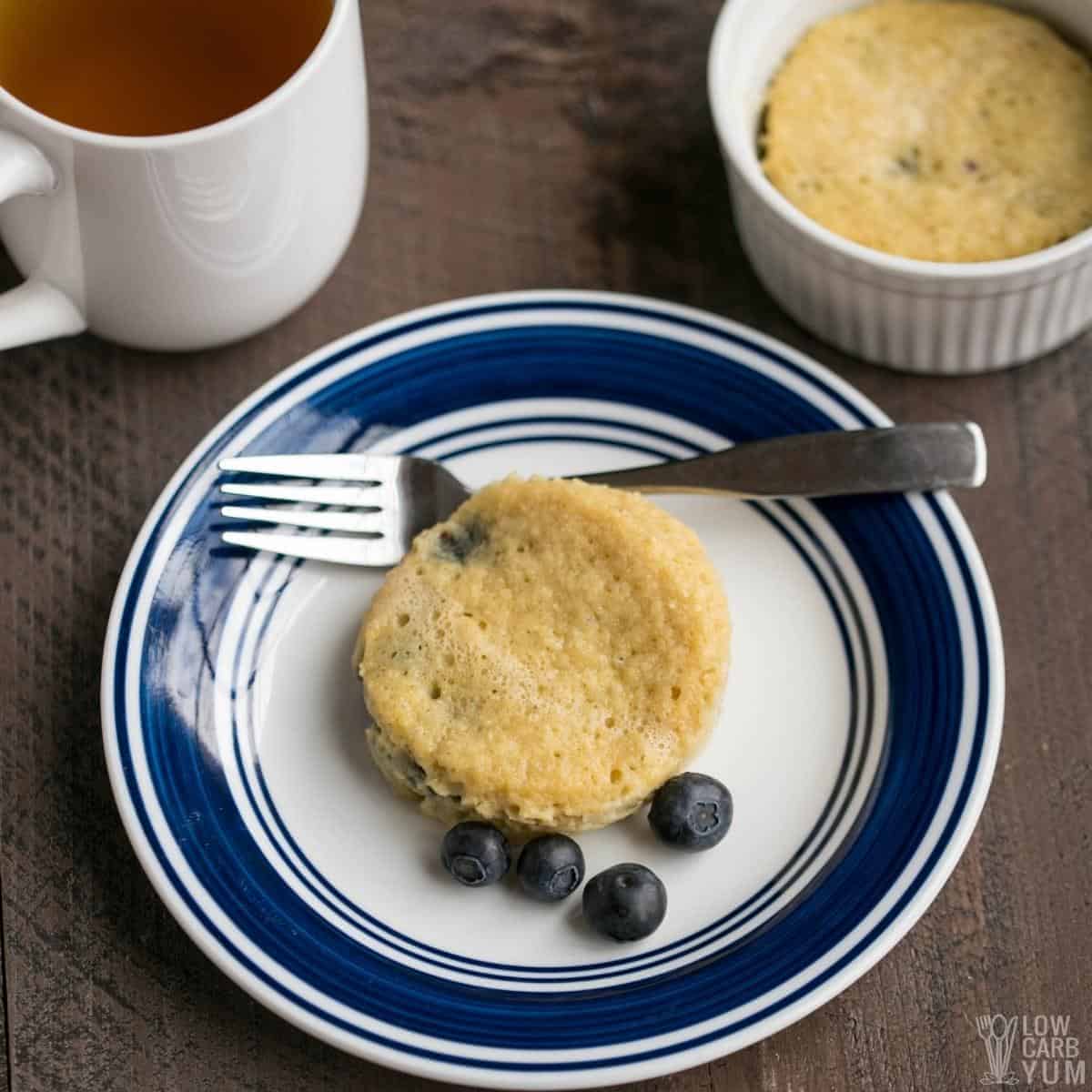 blueberry mug cake on white plate.