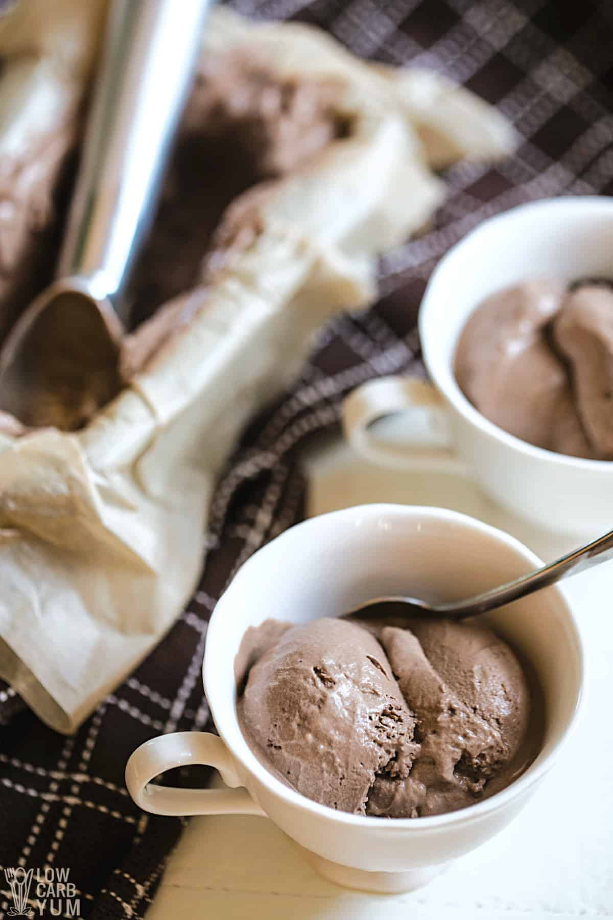 serving chocolate keto dairy free ice cream in small white teacups.