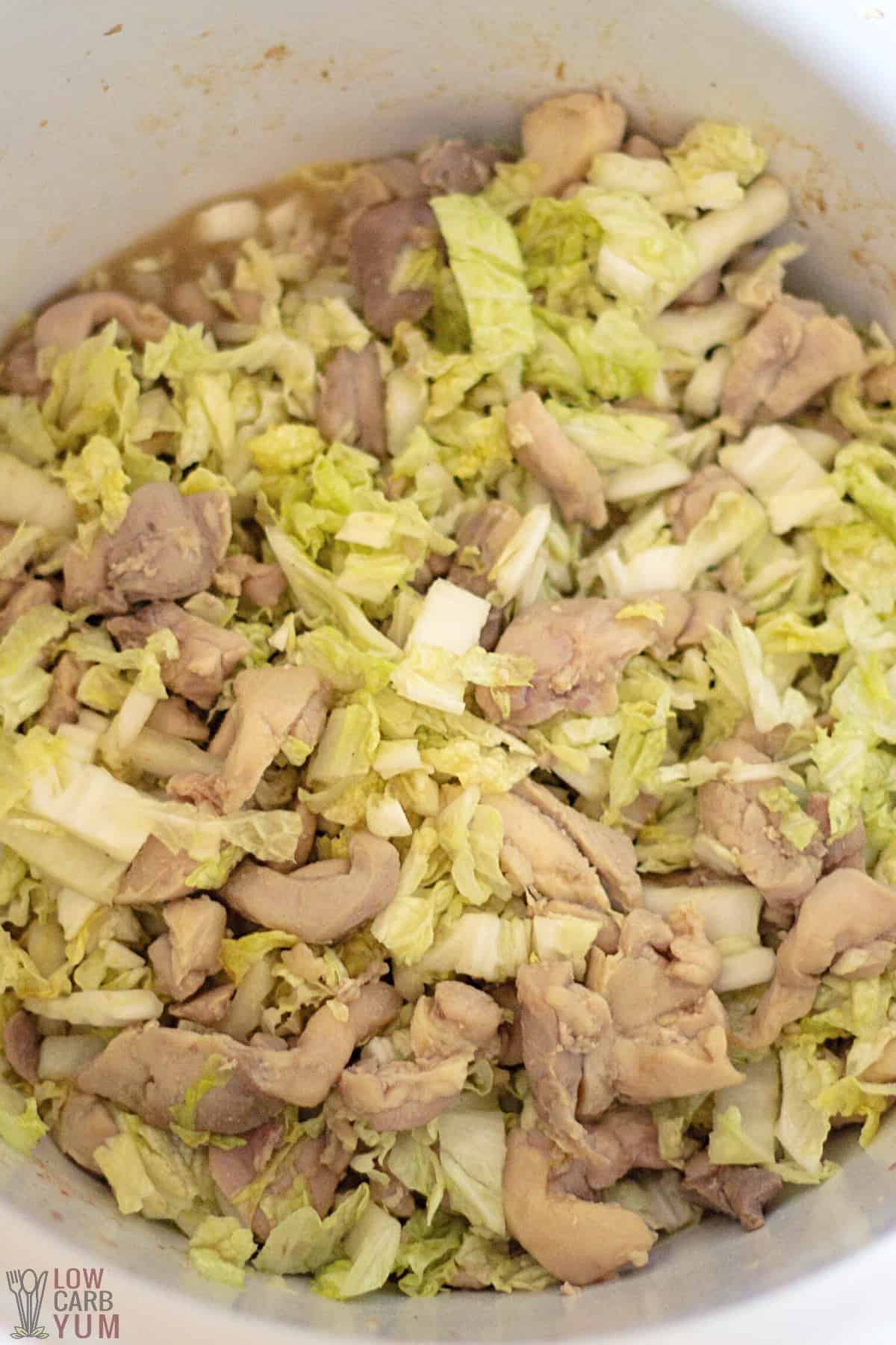 sauce added to cabbage and chicken in crock pot.