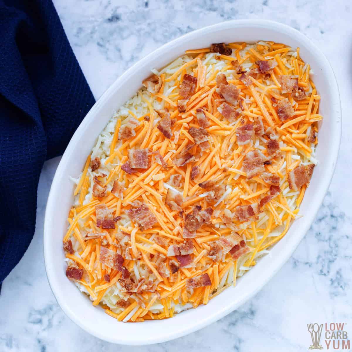 unbaked cauliflower casserole in baking dish.