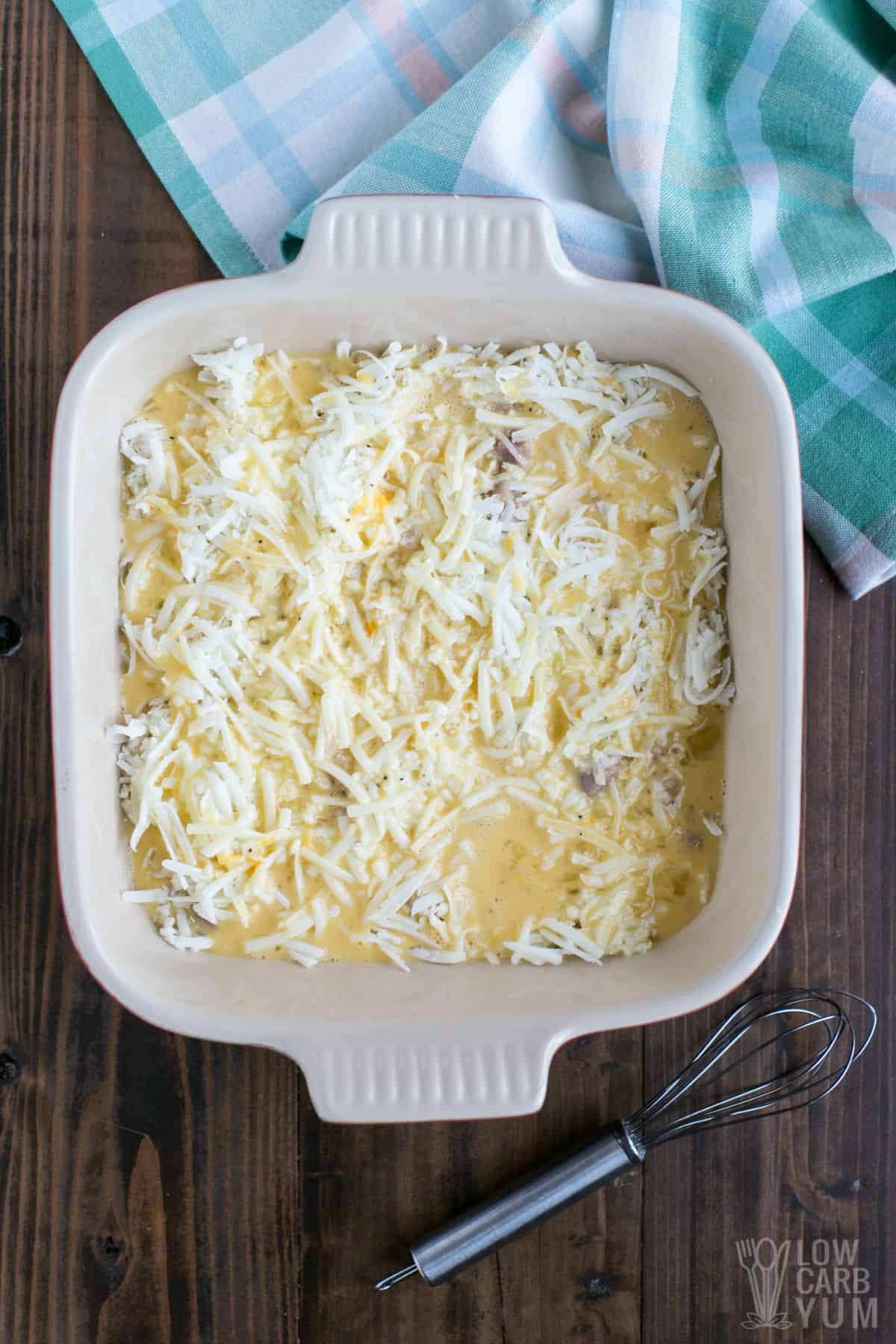 unbaked egg bake in square baking dish.