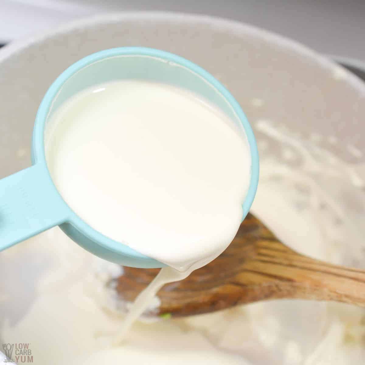 adding heaving whipping cream to the melted cream cheese mixture.