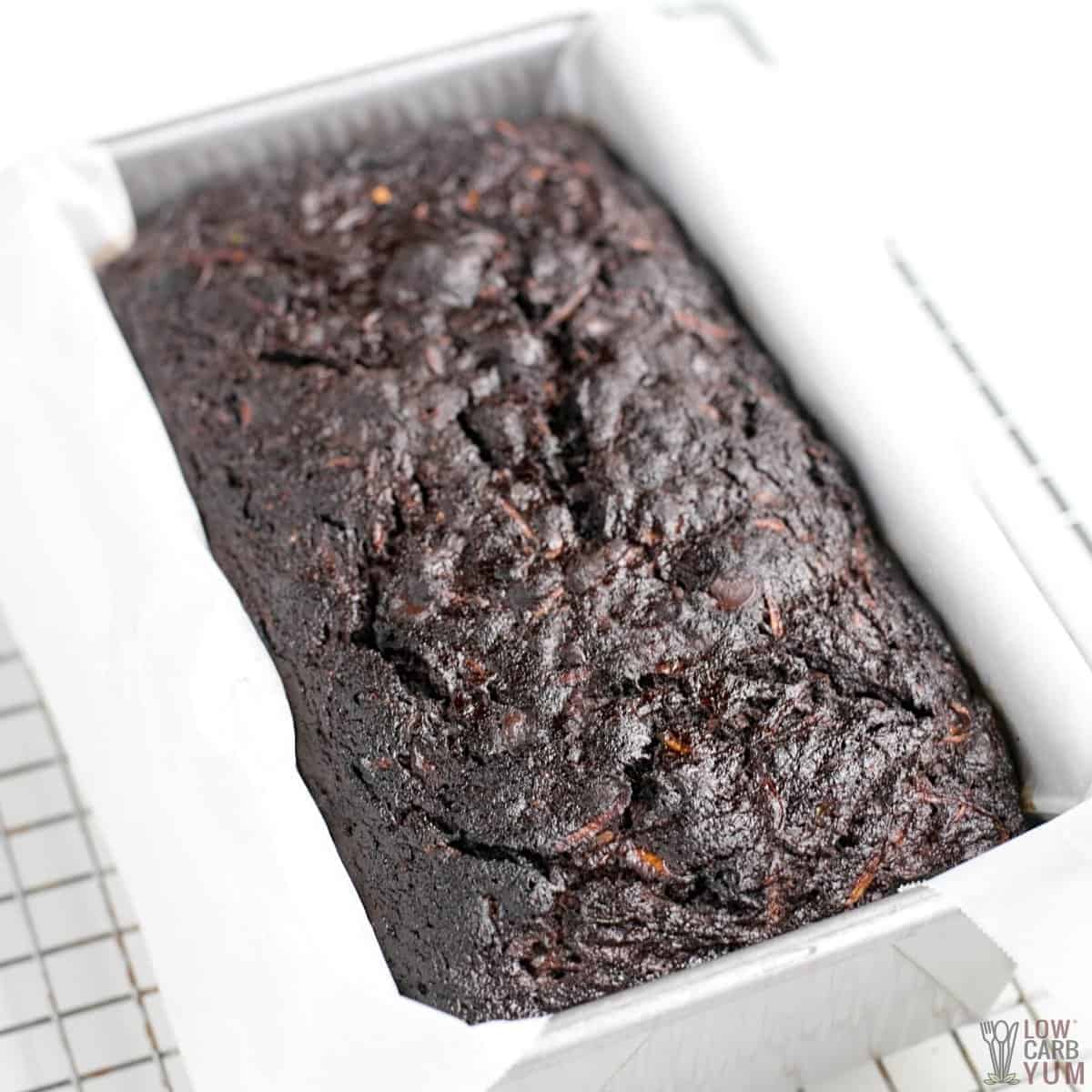 baked chocolate zucchini bread in lined loaf pan.