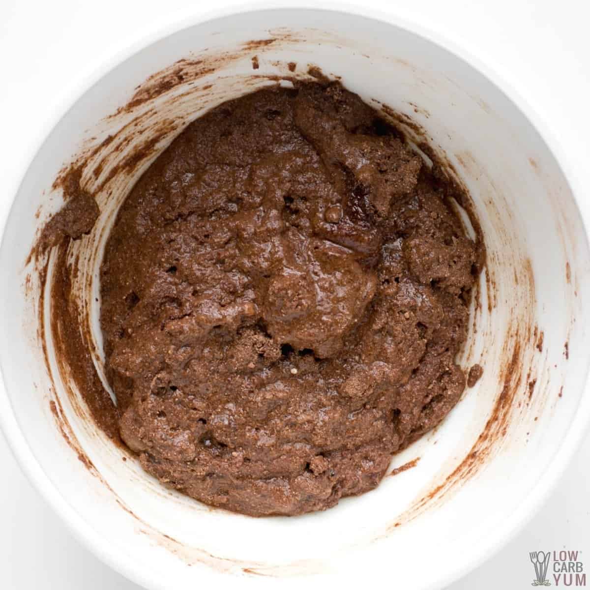 chocolate zucchini bread batter in white mixing bowl.