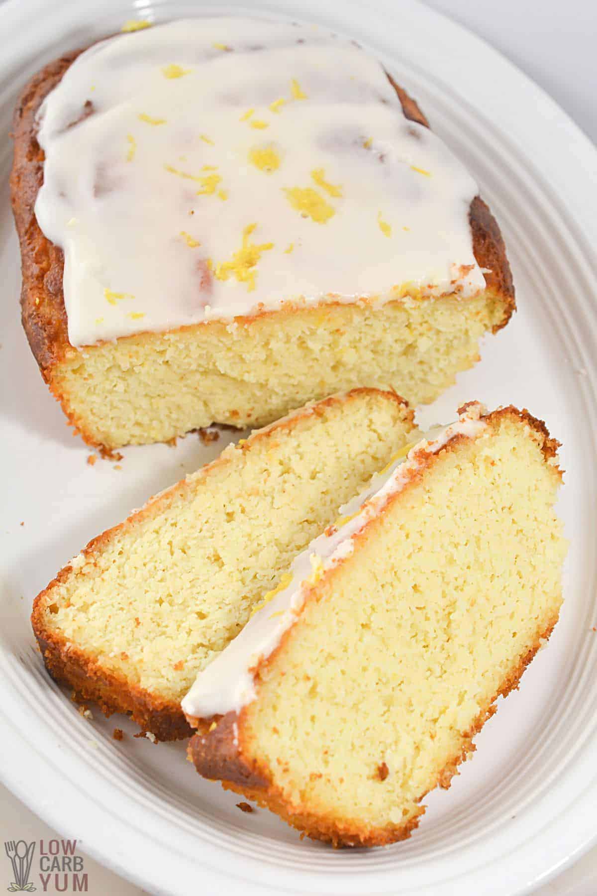 lemon loaf sliced on oval white platter.