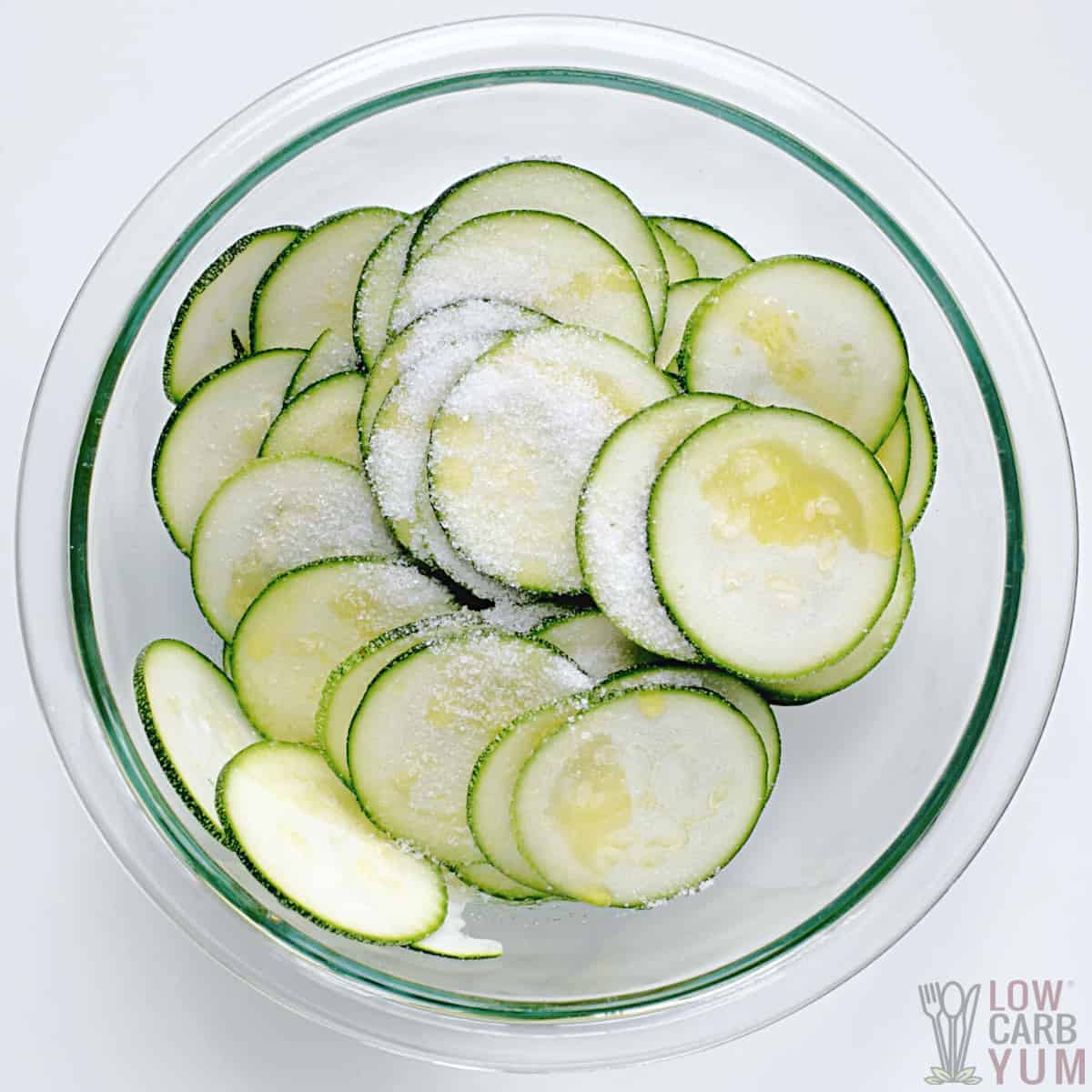 salt and oil added to zucchini slices.