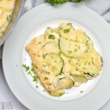 scalloped zucchini on serving plate.