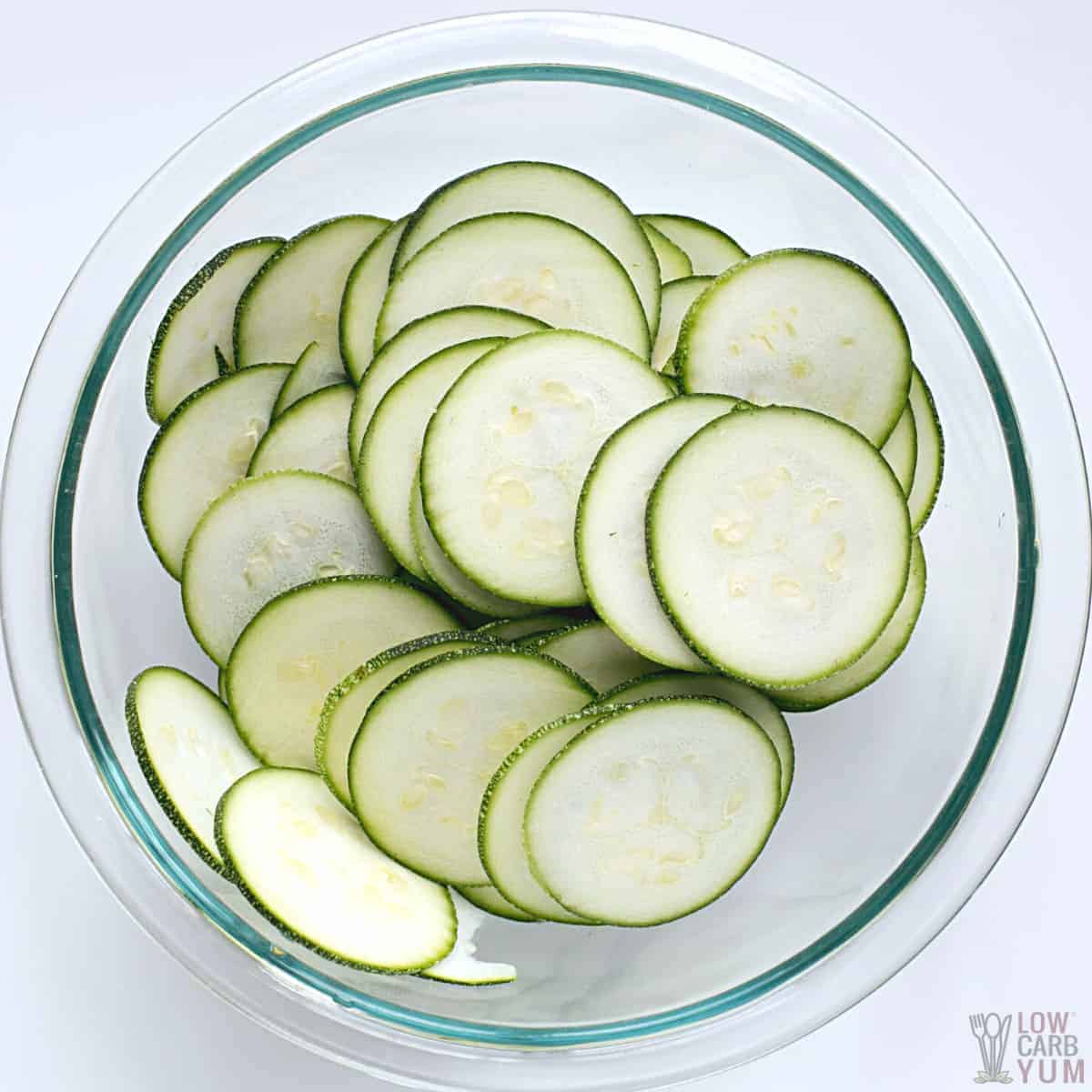 sliced zucchini in glass mixing bowl.