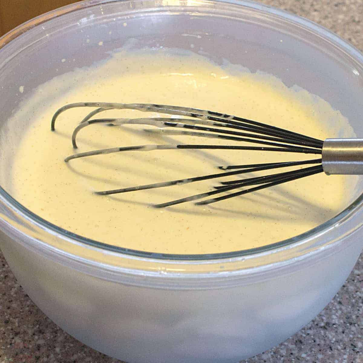 cream cheese milk mixture over ice bath.