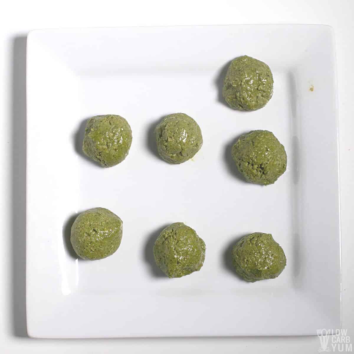 Fat keto peanut butter, cheesecake, matcha balls and keto matcha coconut  bulletproof tea in blue cup. keto protein balls and matcha tea recipes  ingredients. it works ketogenic diet. blue background Photos