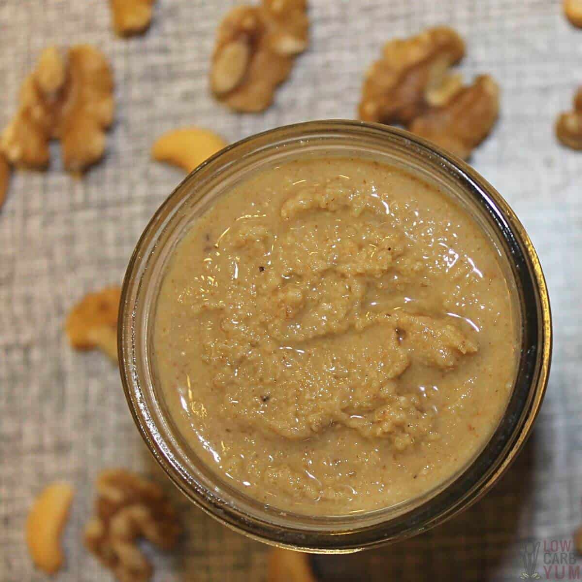 cashew and walnut butter in jar with nuts.