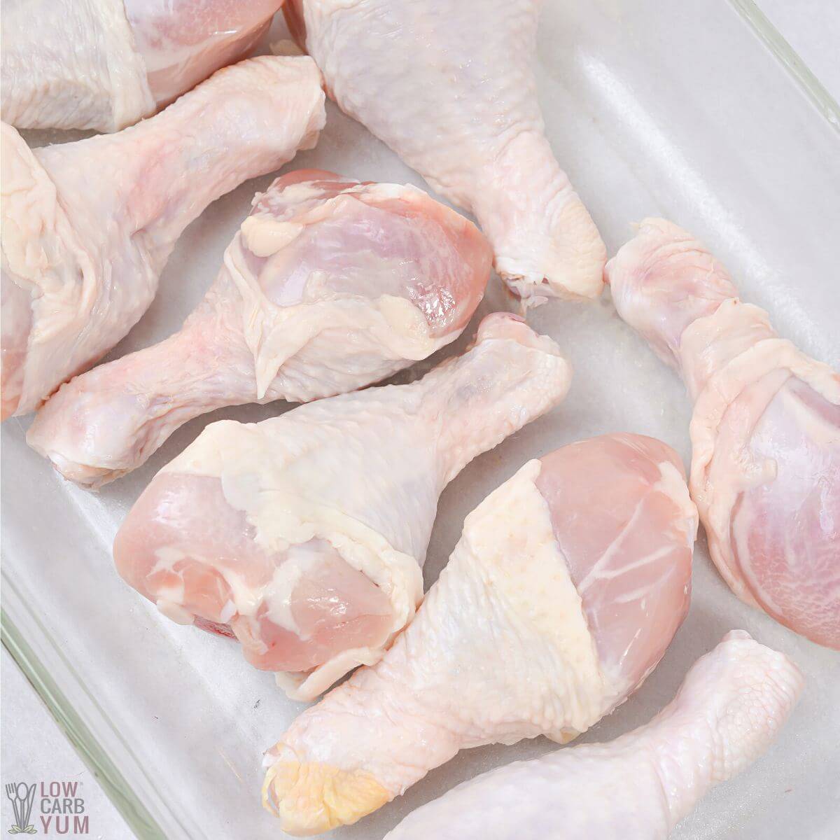 chicken legs in baking dish.