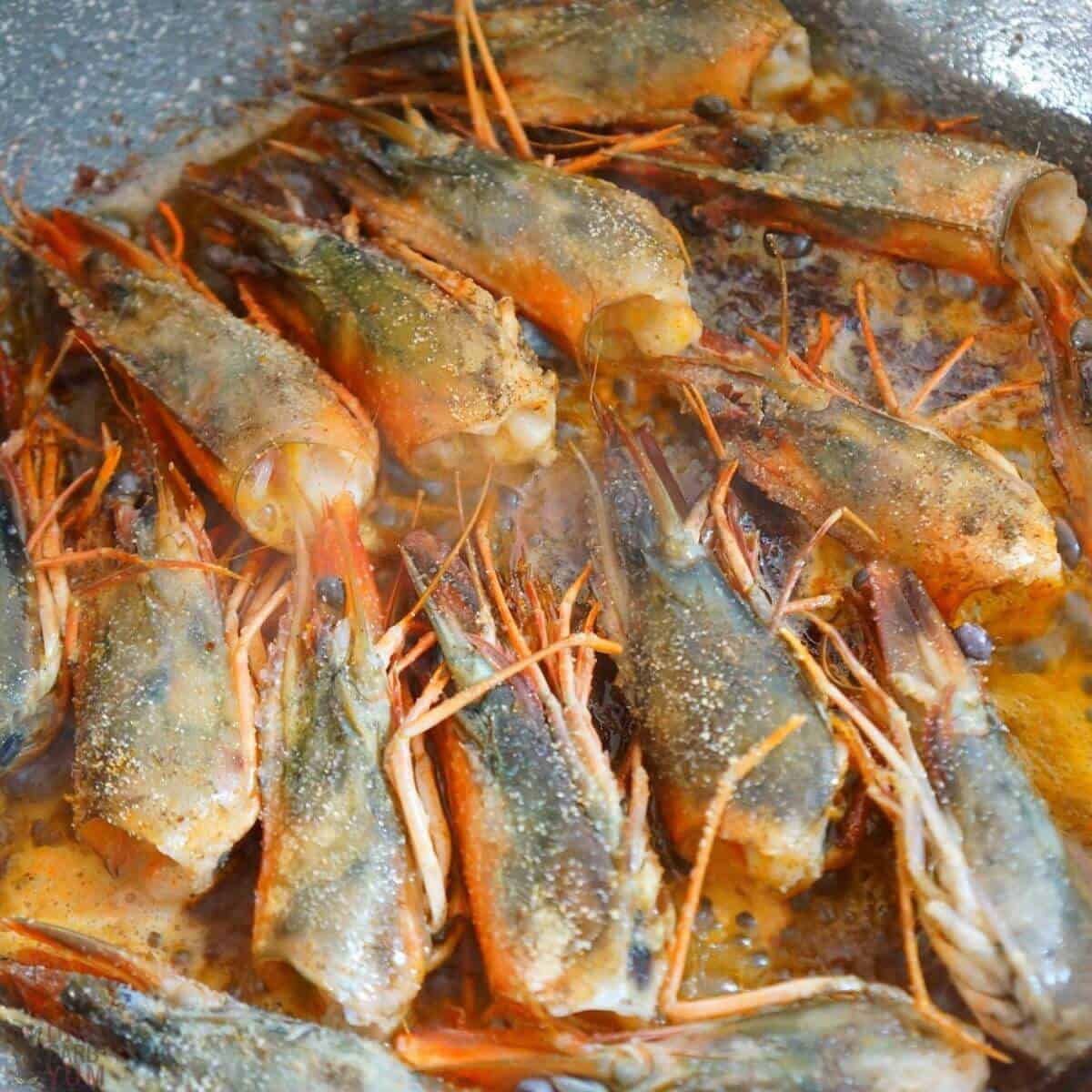 frying prawn heads.