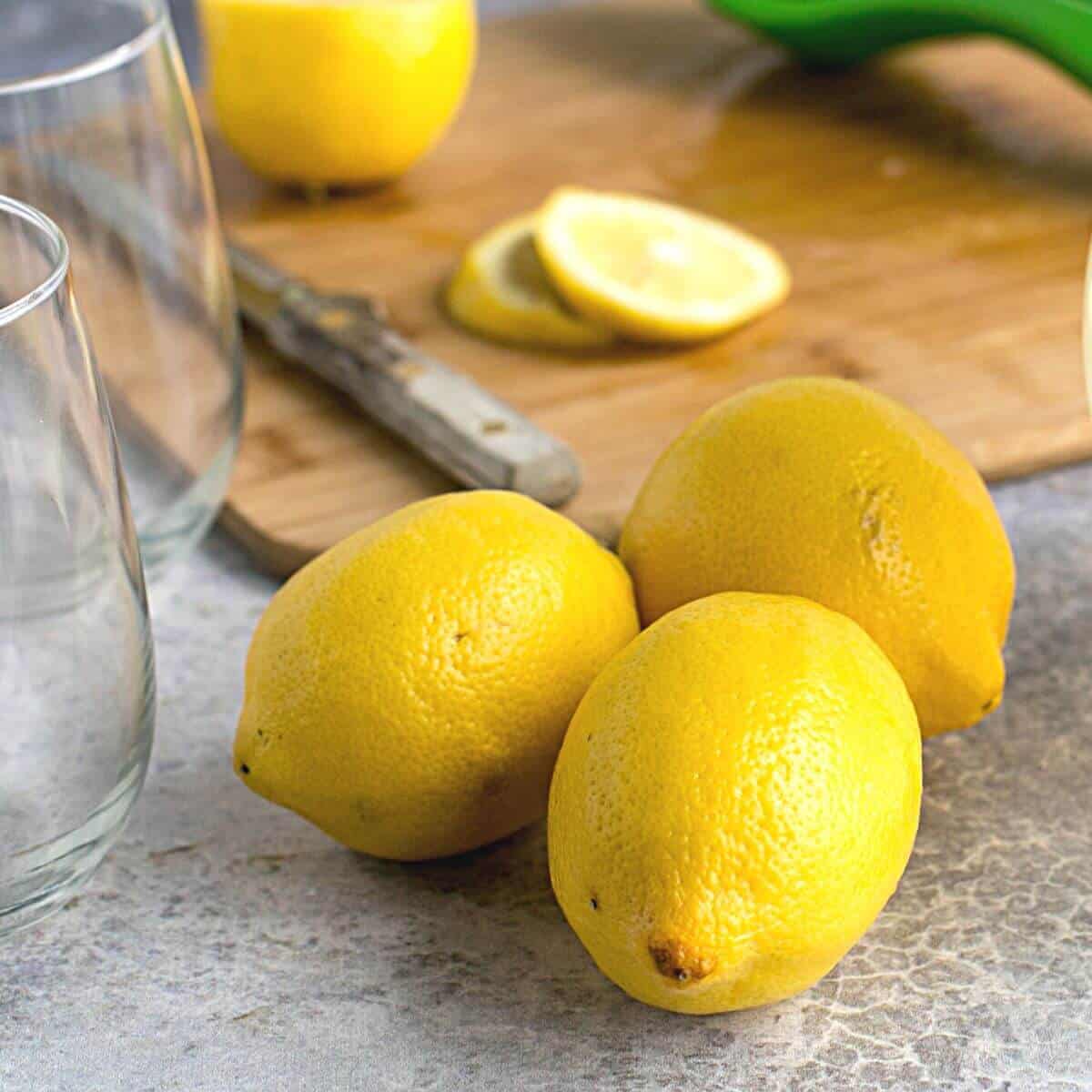 lemons and glasses for keto lemonade.