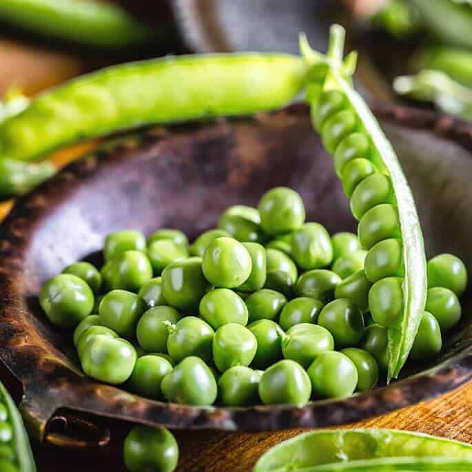 peas in small wood bowl.