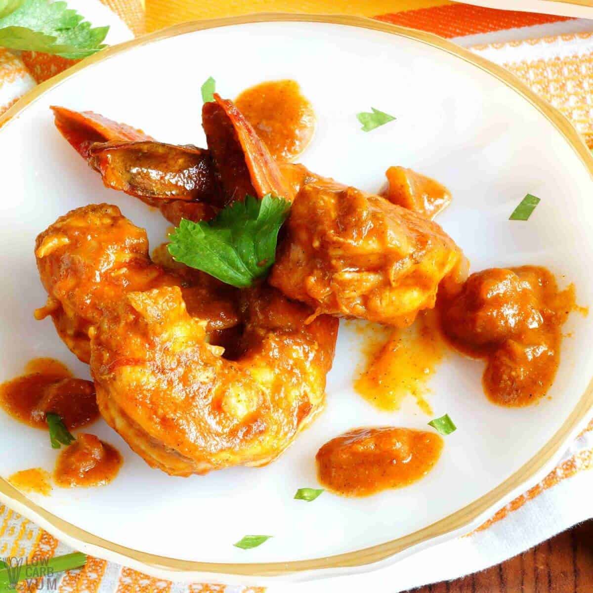 prawn curry with coconut milk serving on plate.