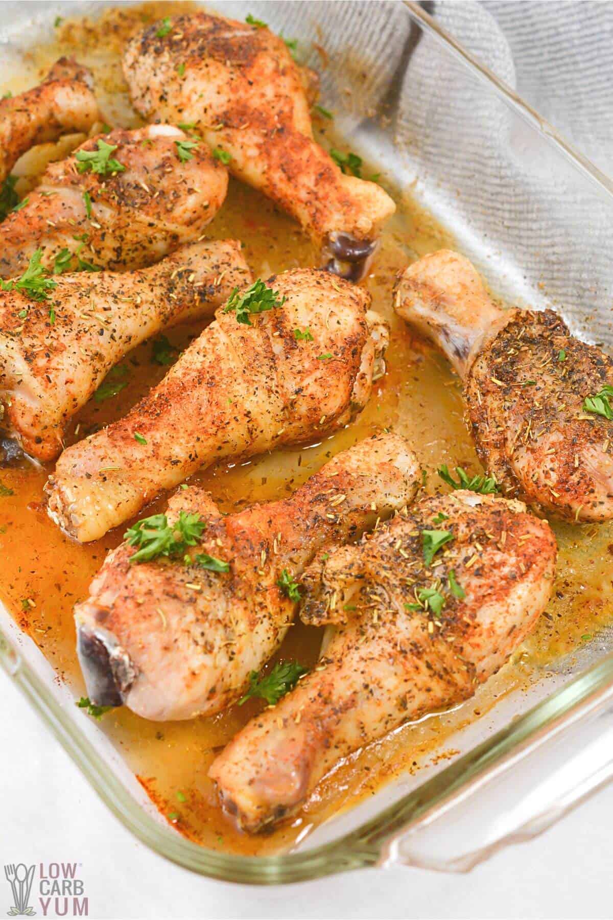 roasted chicken legs in baking dish.