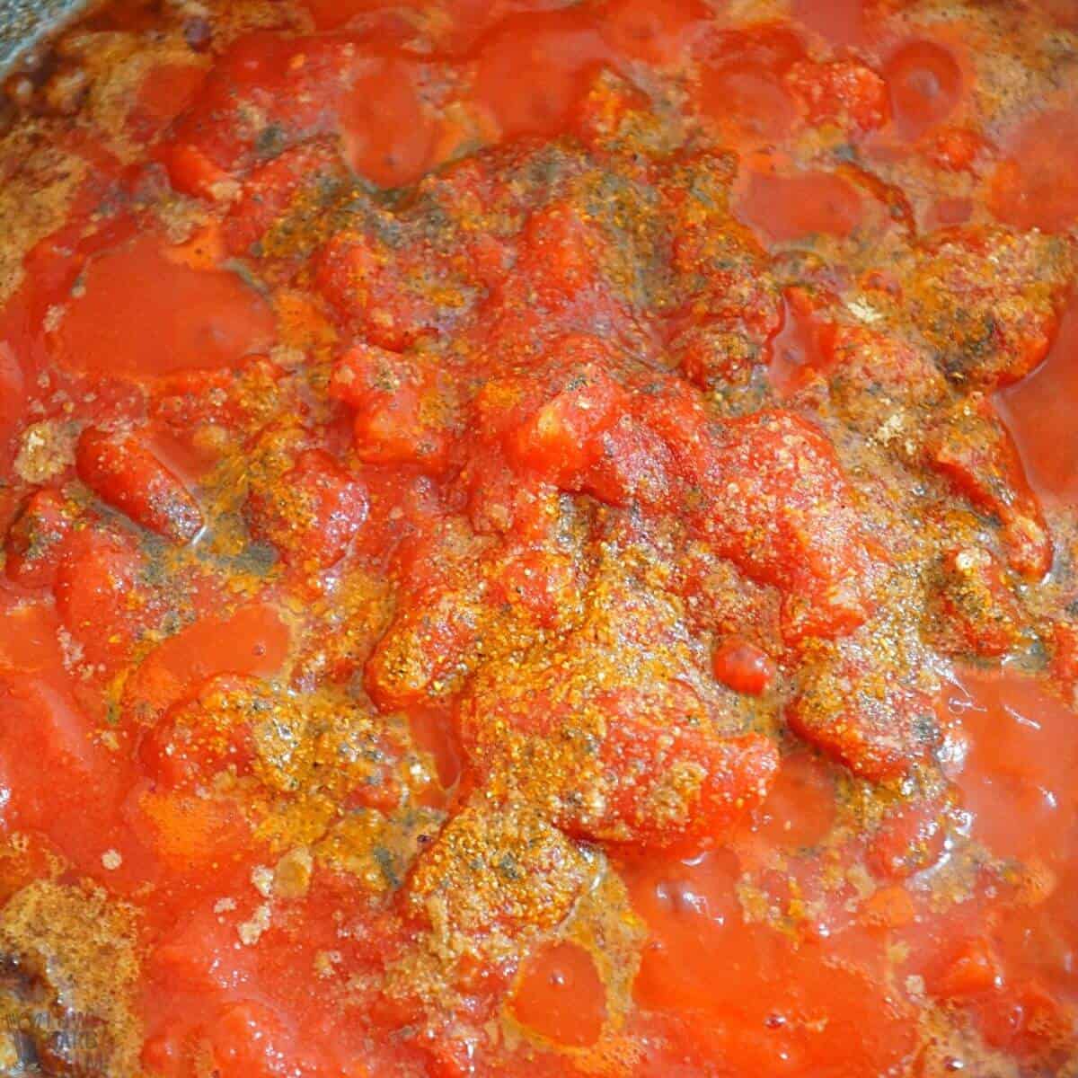 tomato and spices in pan.