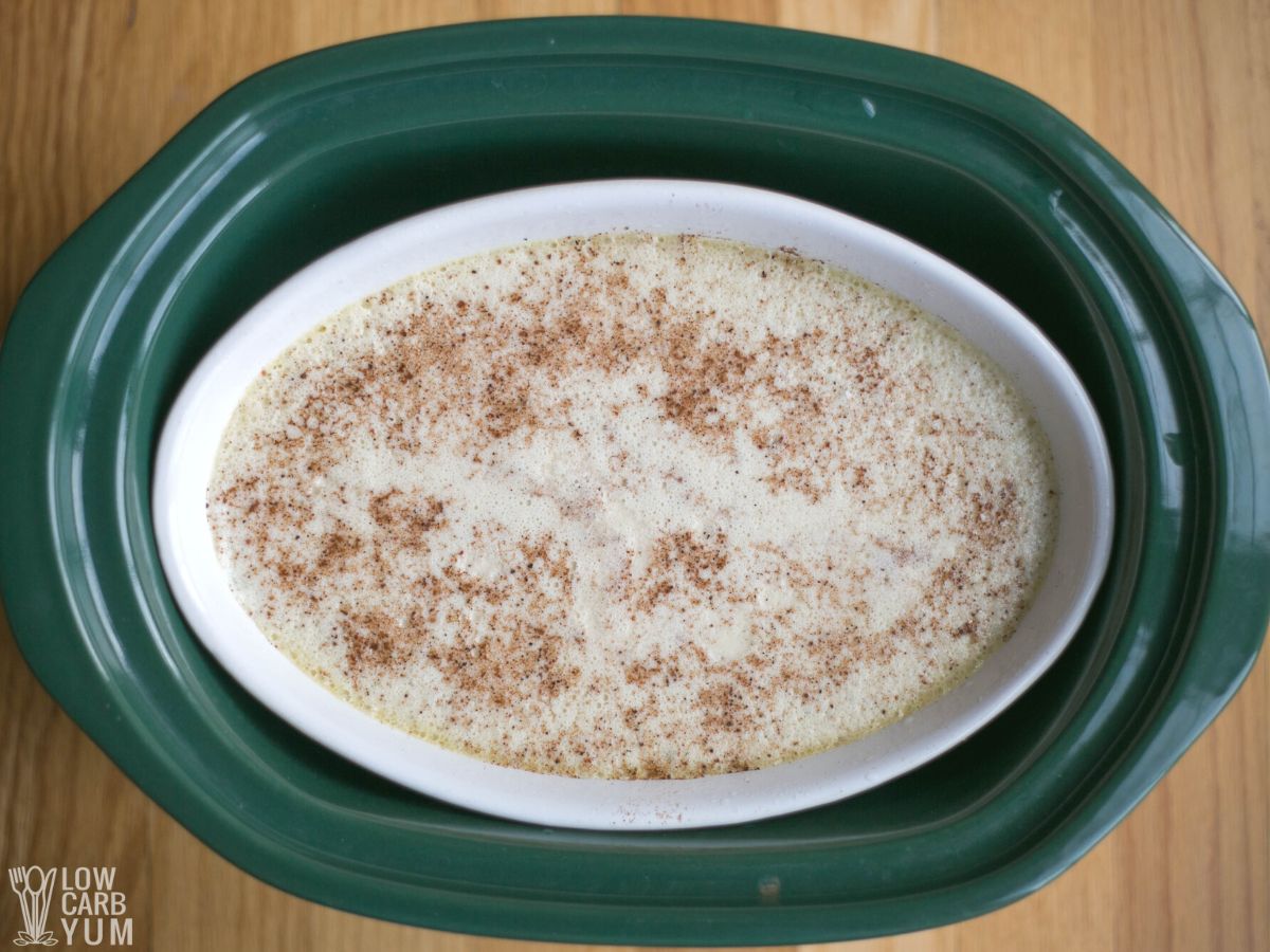 baking dish with pudding mixture inside crock pot.