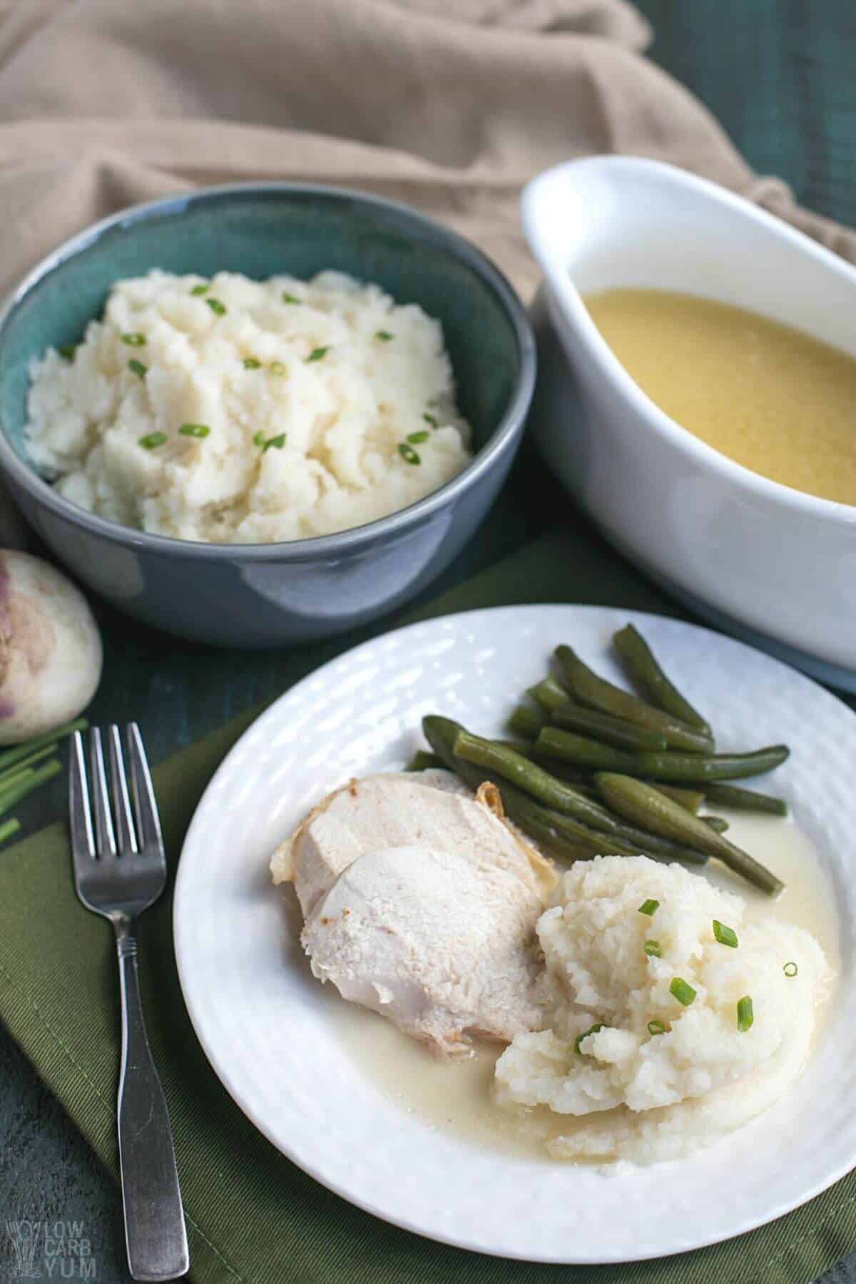 serving mashed turnips with turkey and gravy.