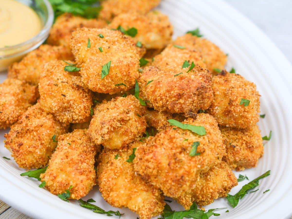 air fried chicken nuggets on a white platter