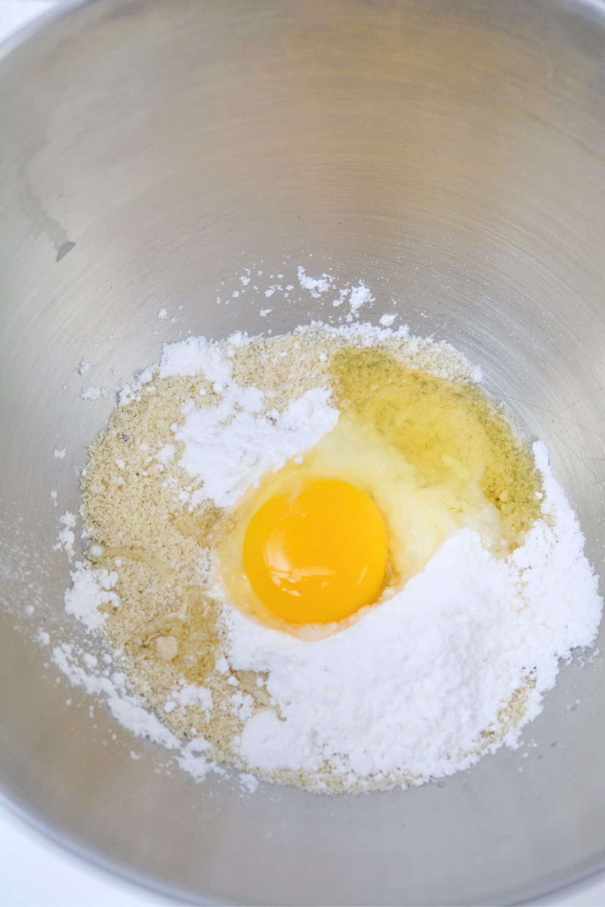 adding ingredients to the bowl